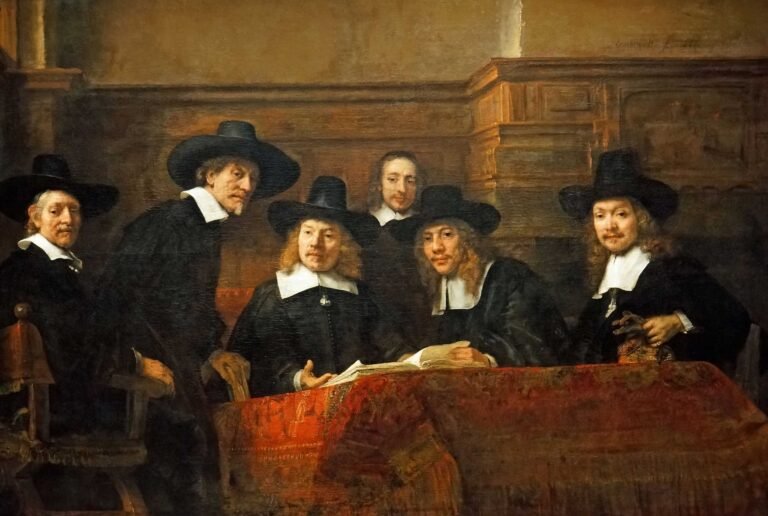 image of The Sampling Officials (De Staalmeesters), a painting by the renowned Dutch artist Rembrandt van Rijn, currently housed in the Rijksmuseum in Amsterdam.